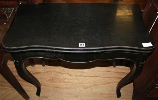 Ebonised serpentine front card table